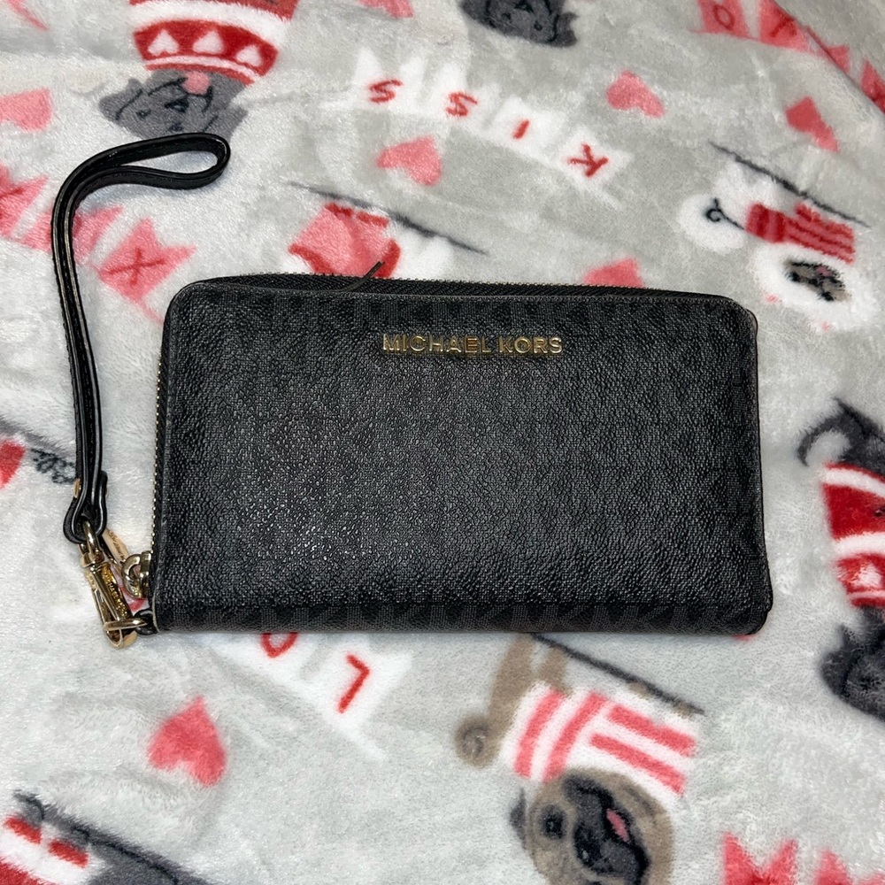 Michael Kors black monogram wallet that also holds phone.